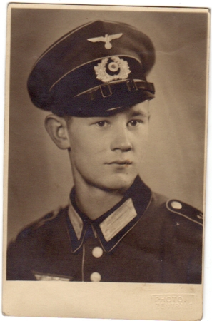 Portrait photo soldier Wehrmacht in parade tunic with peaked cap