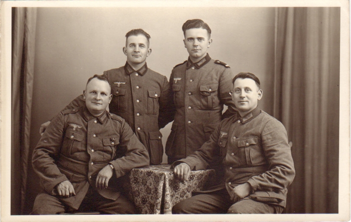 Postcard sized photo four soldiers Wehrmacht