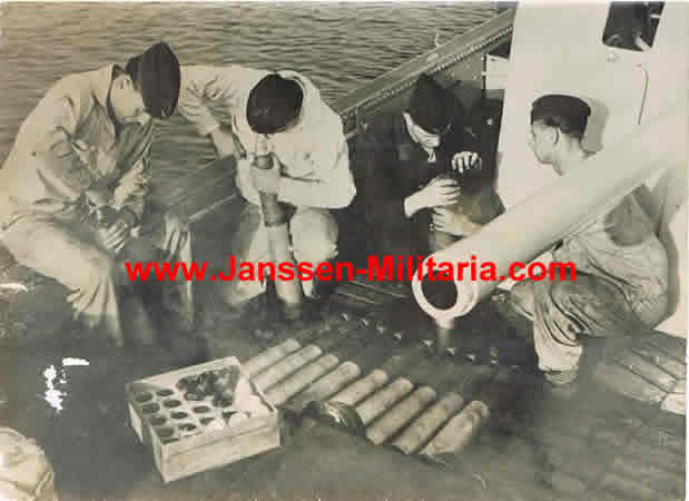 Press photo Kriegsmarine preparing grenades on board of ship