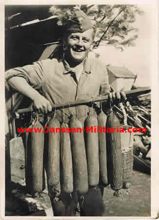 Press photo soldier Wehrmacht with sausages 1942